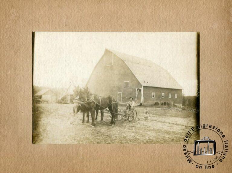 U.S.A., a farmer originally from Italy pictured in front of his farm