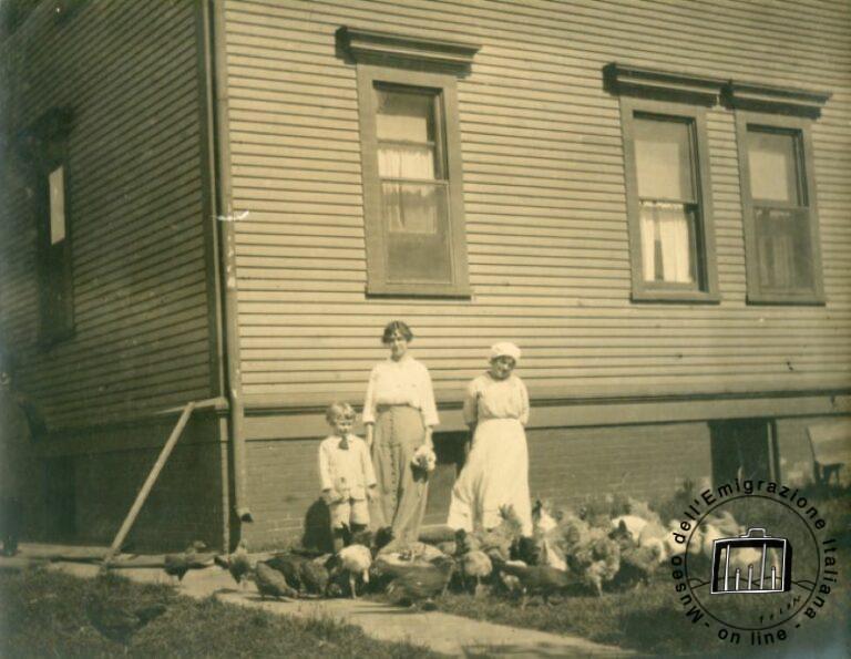 U.S.A., Pennsylvania, Elwood City, 1920s. Alice Nardini with her son in their home courtyard